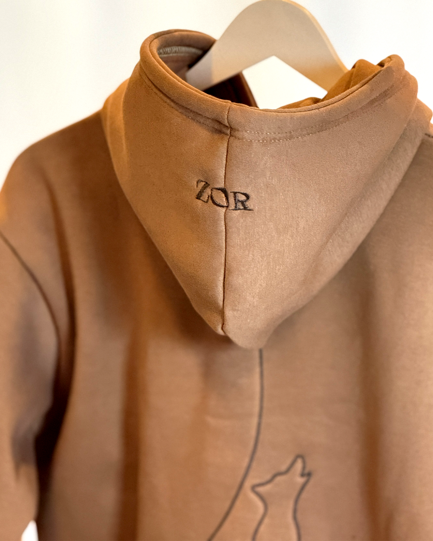 Zor Lifestyle, Brown Hoodie, Hoodies for men, Hoodies for Women, Brown hoodie with 'ZOR' logo on a hanger